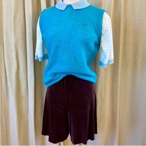 Knit Vest shirt has a boxy silhouette and unique looped knit texture Retro